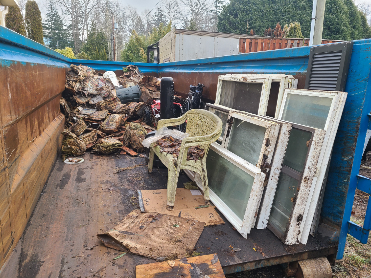 Yard waste and rubbish removal in progress